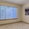Well lit bedroom with large window