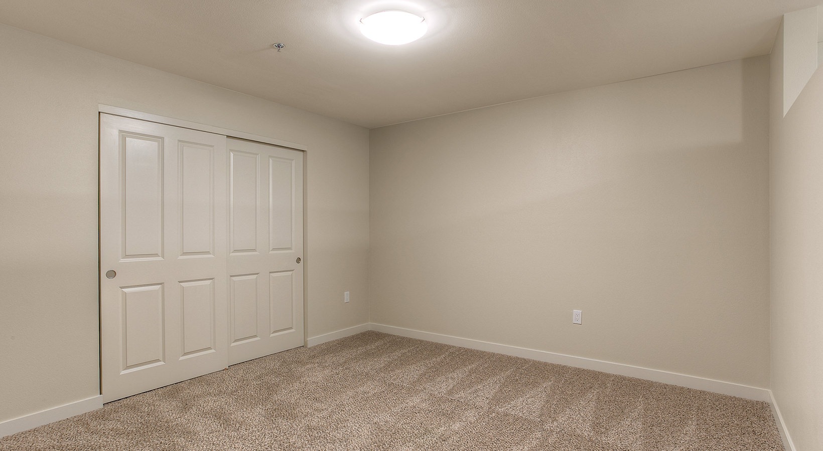 Bedroom Spacious and well lit bedroom with plush carpet
